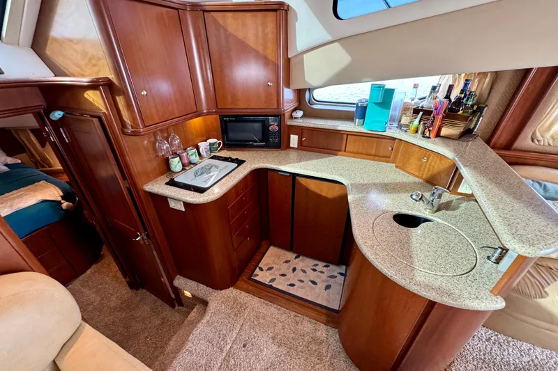  Yacht Photos Pics Luxurious 2006 Silverton 38 Sport Bridge yacht interior with modern kitchen amenities.