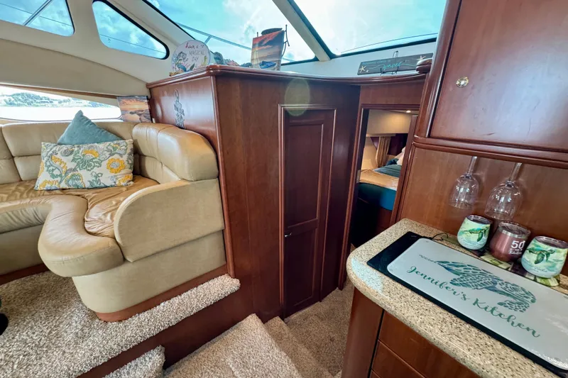  Yacht Photos Pics Interior of 2006 Silverton 38 Sport Bridge yacht with cozy seating and elegant wood finishes.