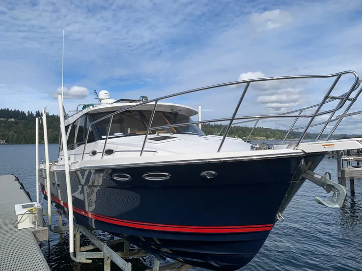  Yacht Photos Pics 2018 Cutwater C-302 Coupe boat docked on a sunny day.