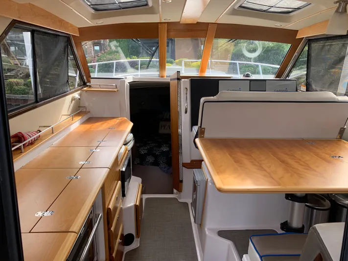  Yacht Photos Pics Interior of 2018 Cutwater C-302 Coupe, featuring wood finishes and modern amenities.