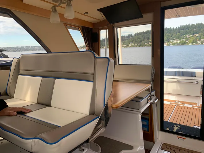  Yacht Photos Pics Interior of 2018 Cutwater C-302 Coupe with lake view through windows.