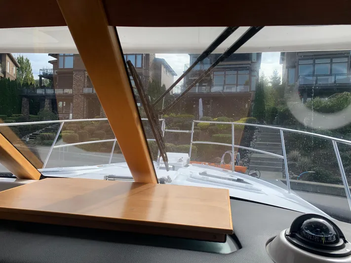  Yacht Photos Pics Interior view of 2018 Cutwater C-302 Coupe boat, showing dashboard and windshield.