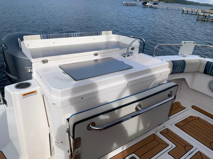  Yacht Photos Pics 2018 Cutwater C-302 Coupe boat with outdoor kitchen and scenic water view.