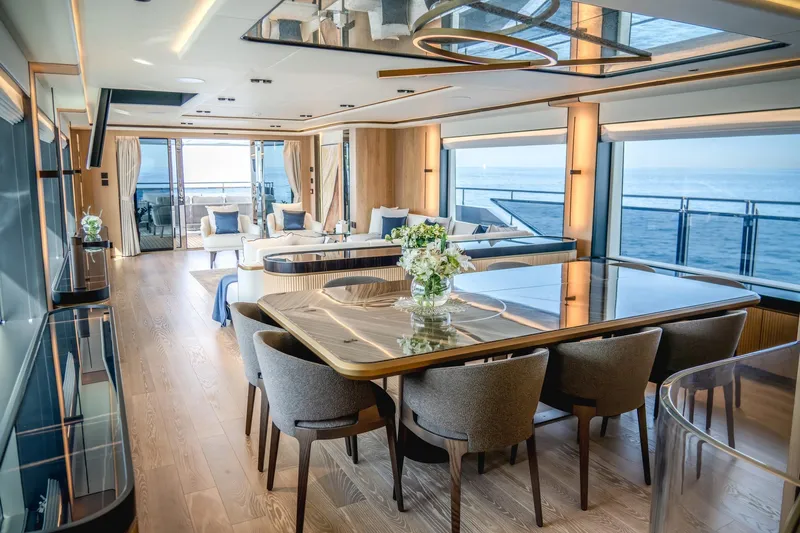  Yacht Photos Pics Luxurious interior of 2027 Majesty 112 Terrace yacht with elegant dining and ocean views.
