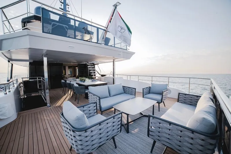  Yacht Photos Pics Luxurious 2027 Majesty 112 Terrace yacht deck with elegant seating and ocean view.