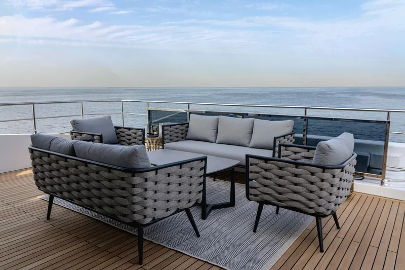  Yacht Photos Pics Luxury outdoor seating on Majesty 112 Terrace yacht, 2027, overlooking the ocean.