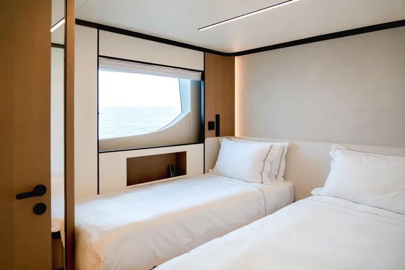  Yacht Photos Pics Luxurious cabin interior of 2027 Majesty 112 Terrace yacht with ocean view.