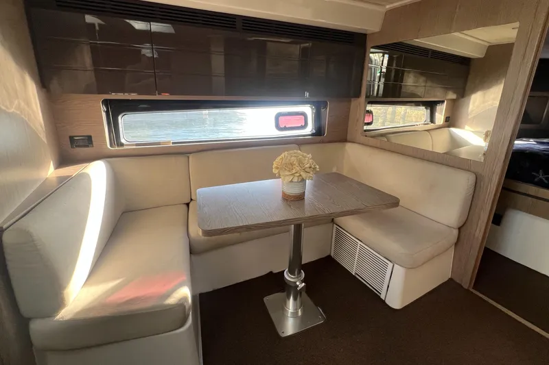  Yacht Photos Pics 2018 Azimut Atlantis 43 yacht interior with cozy dining area and elegant decor.