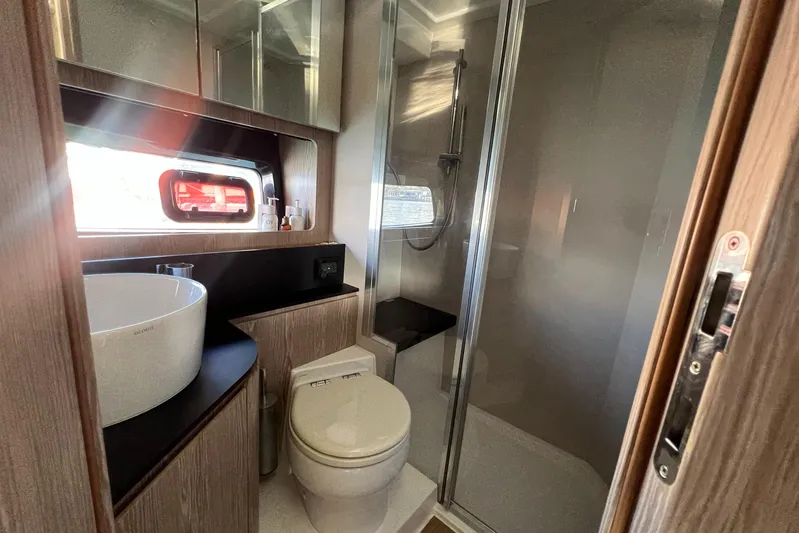  Yacht Photos Pics Luxurious bathroom in 2018 Azimut Atlantis 43 yacht with modern fixtures and shower.