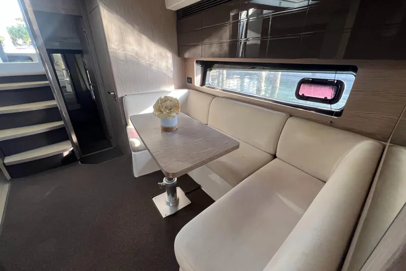  Yacht Photos Pics Interior of 2018 Azimut Atlantis 43 yacht with elegant seating and table arrangement.