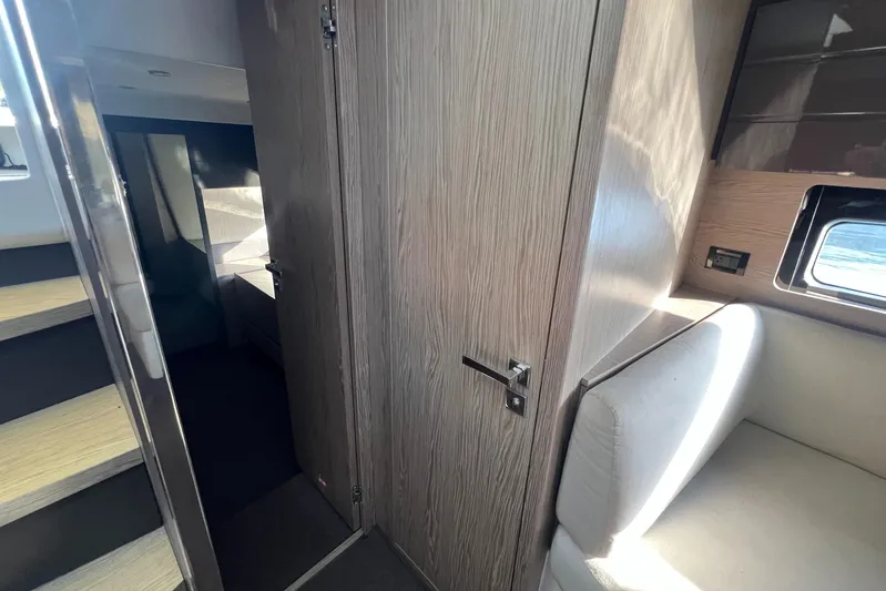  Yacht Photos Pics Interior of 2018 Azimut Atlantis 43 yacht, featuring modern wood paneling and seating.