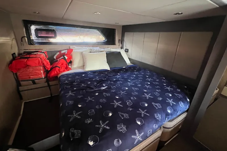  Yacht Photos Pics Interior cabin of 2018 Azimut Atlantis 43 yacht with bed and life jackets.