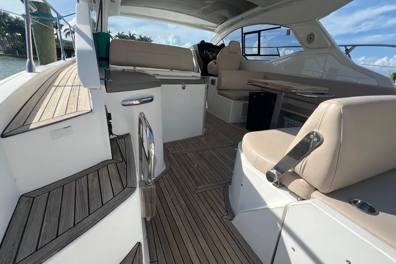  Yacht Photos Pics 2018 Azimut Atlantis 43 yacht interior with elegant seating and wooden flooring.