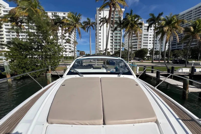  Yacht Photos Pics 2018 Azimut Atlantis 43 yacht docked near palm trees and buildings.