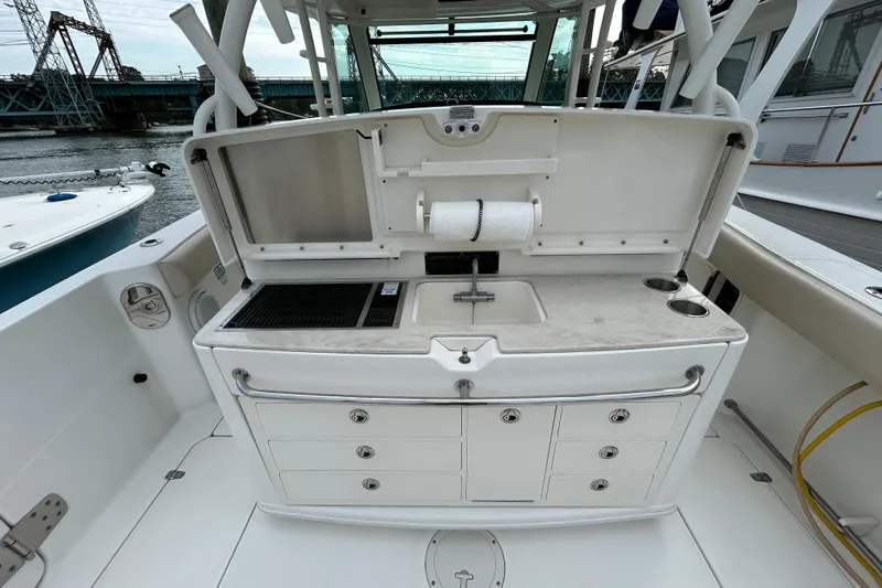  Yacht Photos Pics 2017 Boston Whaler 370 Outrage boat with onboard kitchenette and storage drawers.