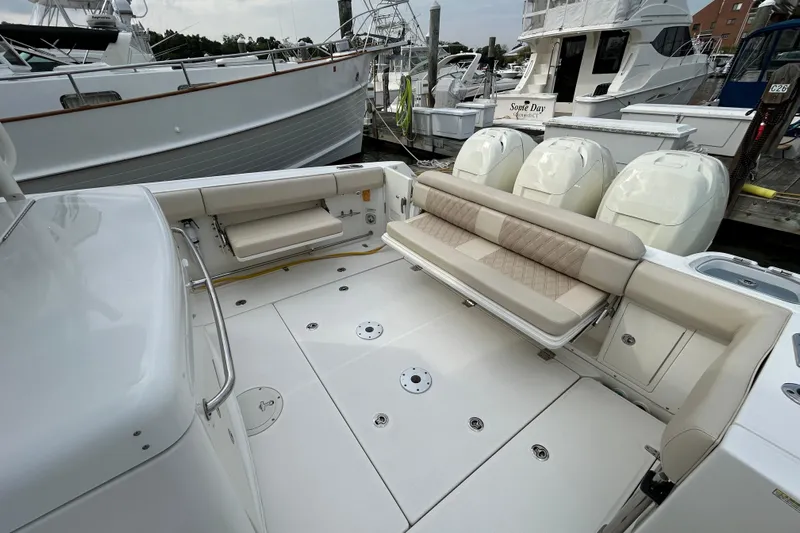  Yacht Photos Pics 2017 Boston Whaler 370 Outrage boat interior with seating and triple outboard engines.