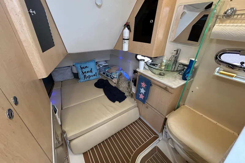  Yacht Photos Pics 2017 Boston Whaler 370 Outrage cabin interior with bed, sink, and toilet.