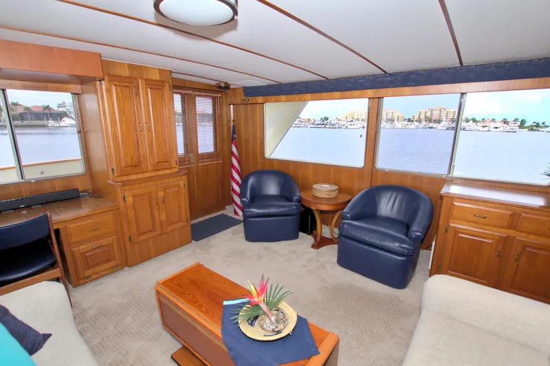 Brown Yacht Photos Pics Luxurious interior of 1989 Tollycraft 61 Pilothouse Motor Yacht with elegant wood finishes.