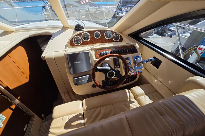 Soul Mates Yacht Photos Pics Interior of a 2005 Meridian 411 Sedan yacht, featuring a luxurious helm and controls.