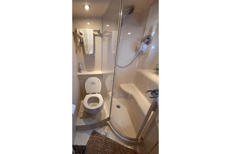 Soul Mates Yacht Photos Pics Compact bathroom in 2005 Meridian 411 Sedan yacht with shower and toilet.