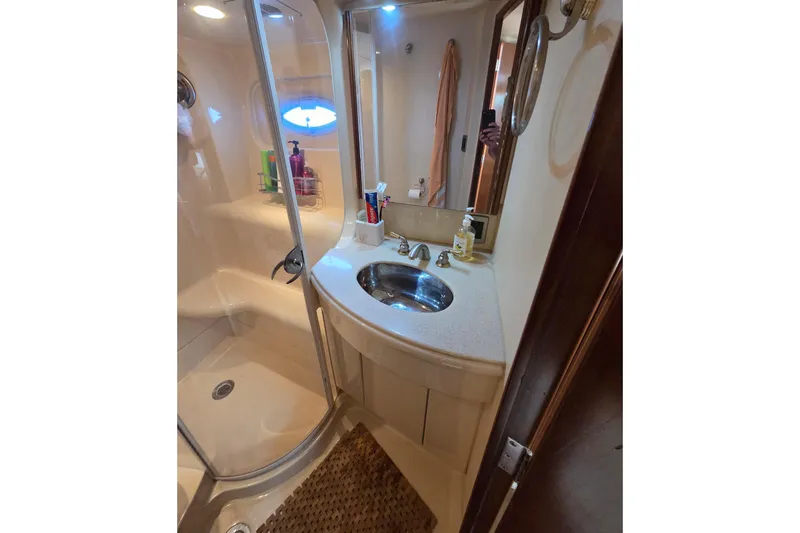 Soul Mates Yacht Photos Pics Bathroom interior of 2005 Meridian 411 Sedan yacht with shower and sink.