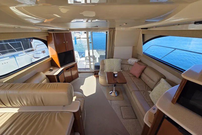 Soul Mates Yacht Photos Pics Luxurious interior of 2005 Meridian 411 Sedan yacht with leather seating and ocean view.