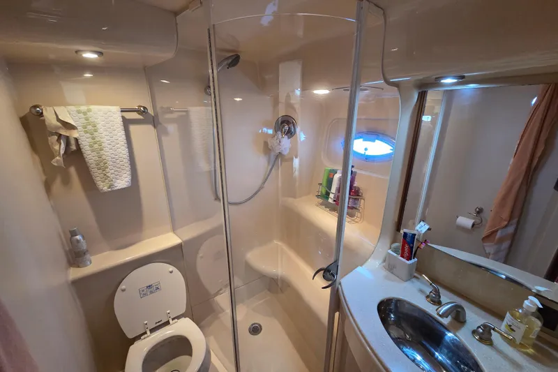 Soul Mates Yacht Photos Pics Bathroom interior of 2005 Meridian 411 Sedan yacht with shower and sink.