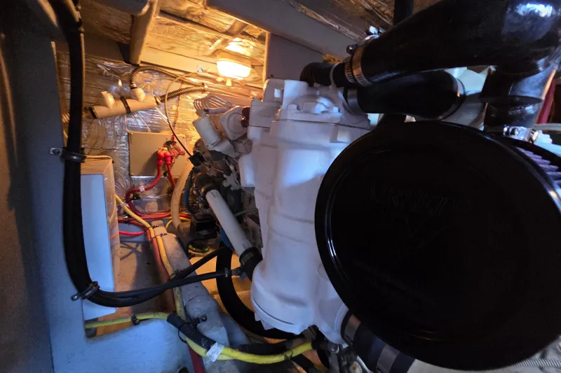 Soul Mates Yacht Photos Pics Engine room of a 2005 Meridian 411 Sedan with visible components and wiring.