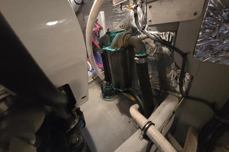 Soul Mates Yacht Photos Pics Engine room of 2005 Meridian 411 Sedan with visible hoses and components.