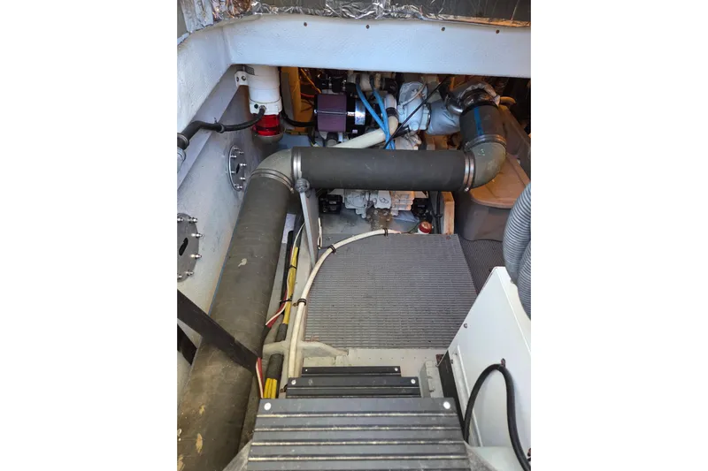 Soul Mates Yacht Photos Pics Engine room of 2005 Meridian 411 Sedan with visible components and piping.