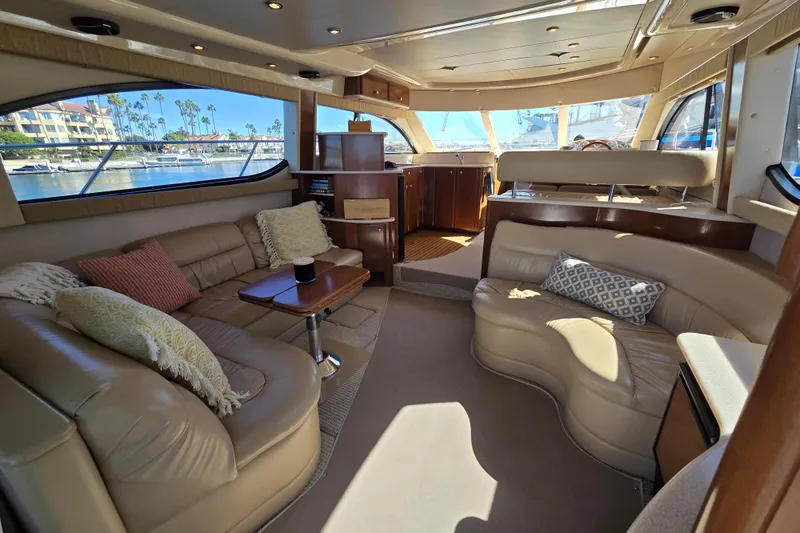 Soul Mates Yacht Photos Pics Luxurious interior of a 2005 Meridian 411 Sedan yacht with plush seating and scenic windows.