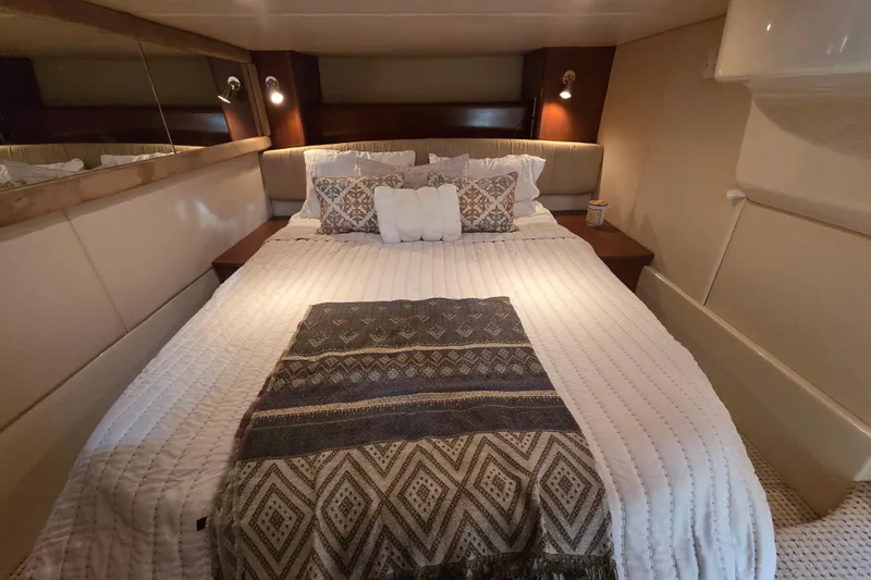 Soul Mates Yacht Photos Pics Luxurious bedroom interior of a 2005 Meridian 411 Sedan yacht with elegant bedding.