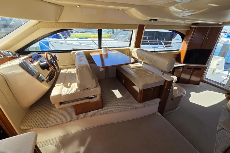 Soul Mates Yacht Photos Pics Luxurious interior of a 2005 Meridian 411 Sedan yacht with plush seating and elegant wood finishes.