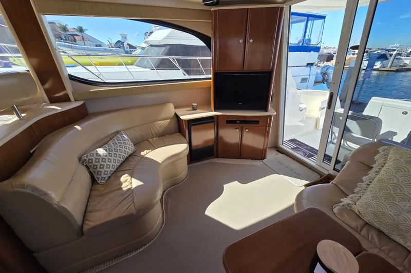 Soul Mates Yacht Photos Pics Luxurious interior of 2005 Meridian 411 Sedan yacht with leather seating and waterfront view.