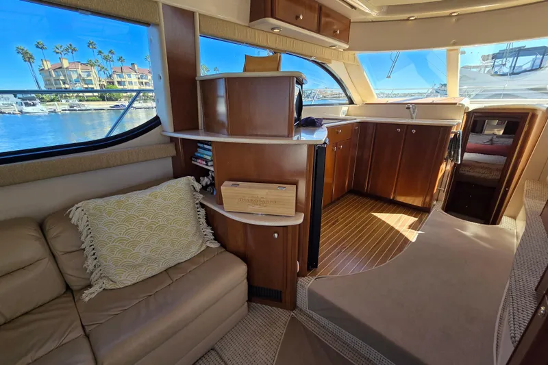 Soul Mates Yacht Photos Pics Luxurious interior of a 2005 Meridian 411 Sedan yacht with elegant wood finishes.