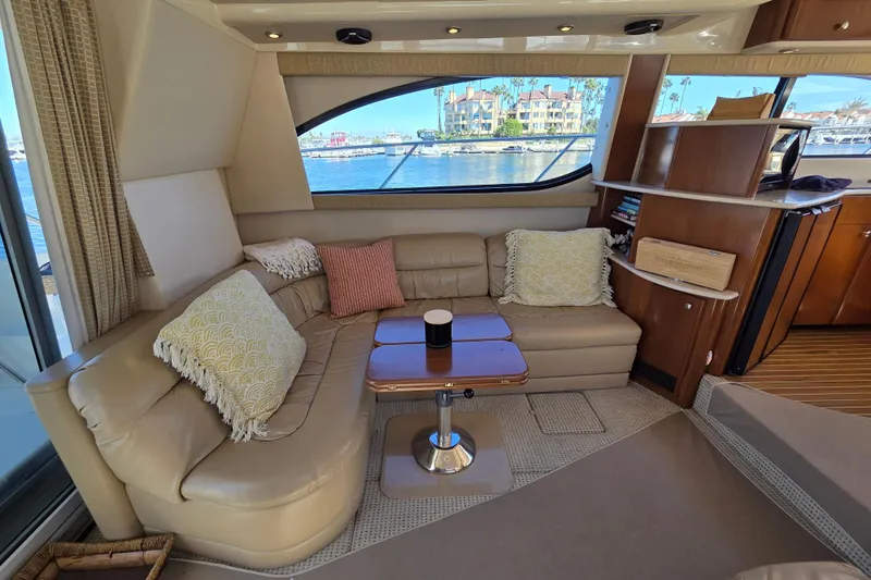 Soul Mates Yacht Photos Pics Luxurious interior of 2005 Meridian 411 Sedan yacht with cozy seating and scenic window view.