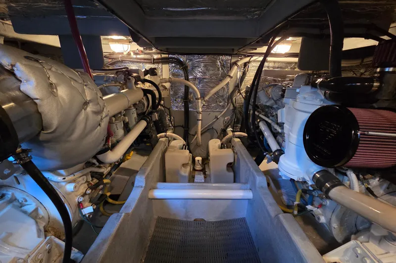 Soul Mates Yacht Photos Pics Engine room of a 2005 Meridian 411 Sedan, showcasing dual engines and mechanical components.