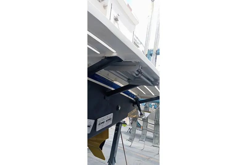  Yacht Photos Pics 2008 Luhrs 31 Hard Top IPS boat underside with visible propeller and support structure.