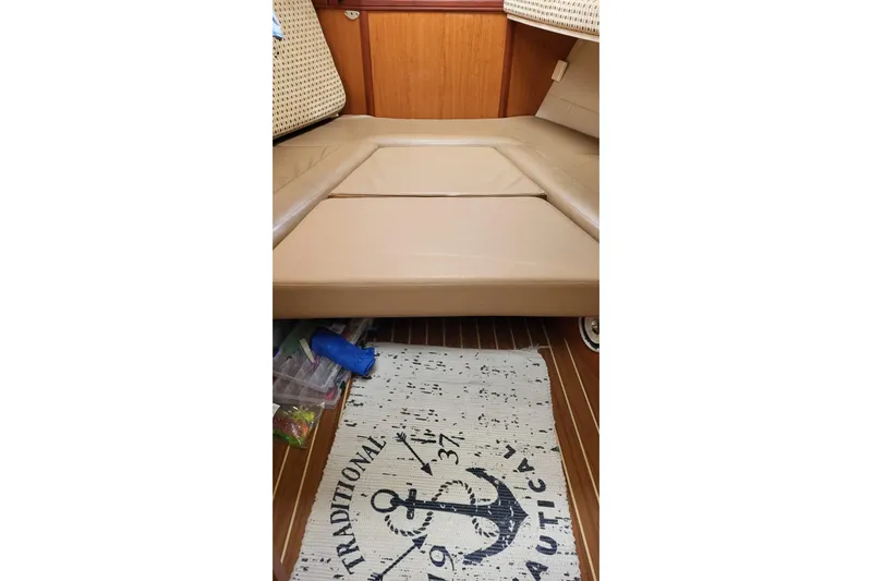  Yacht Photos Pics 2008 Luhrs 31 Hard Top IPS interior with beige seating and nautical-themed rug.