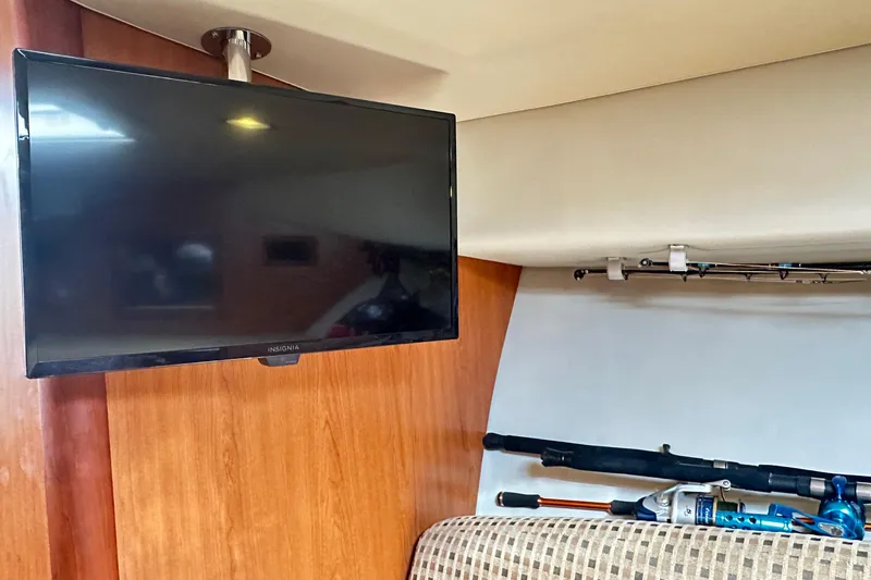  Yacht Photos Pics Interior of 2008 Luhrs 31 Hard Top IPS with TV and fishing rods.