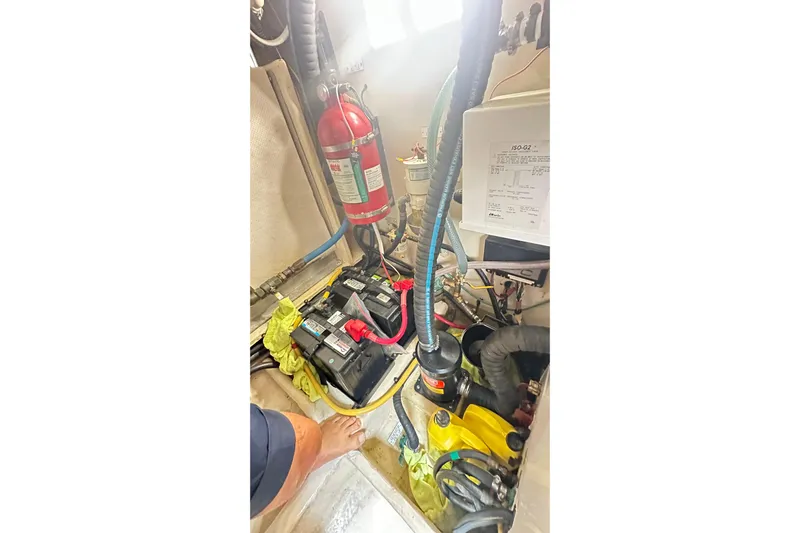  Yacht Photos Pics Engine room of 2008 Luhrs 31 Hard Top IPS with batteries and fire extinguisher.