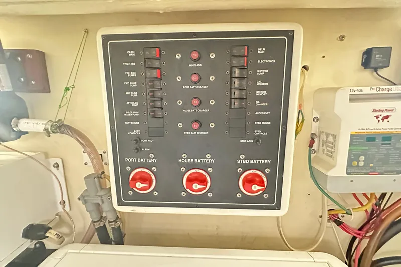  Yacht Photos Pics Electrical panel of a 2008 Luhrs 31 Hard Top IPS boat, featuring battery controls.