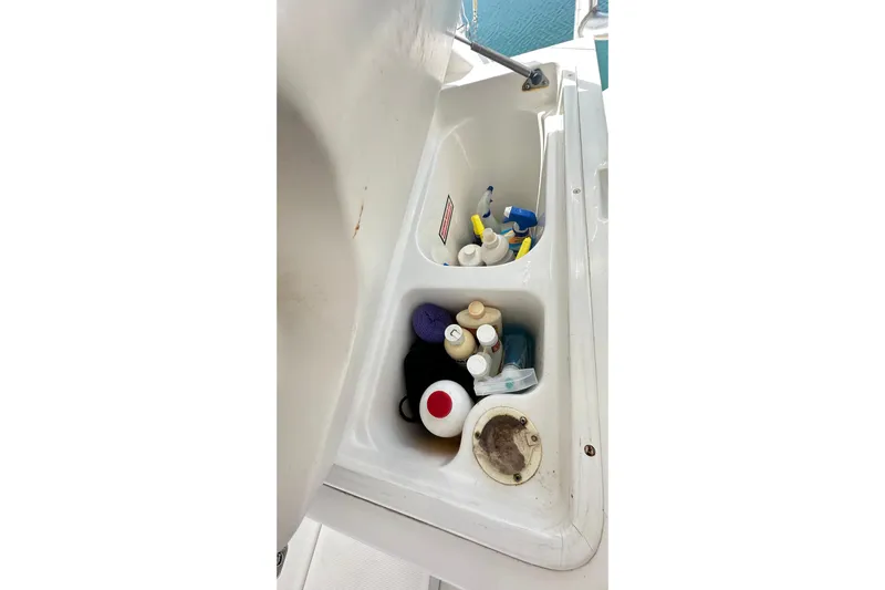  Yacht Photos Pics Storage compartment on 2008 Luhrs 31 Hard Top IPS boat with cleaning supplies.