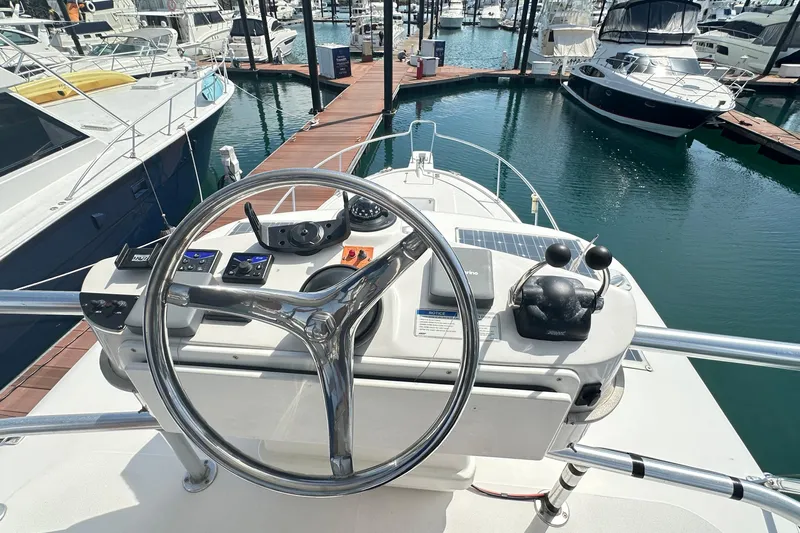  Yacht Photos Pics 2008 Luhrs 31 Hard Top IPS yacht helm with steering wheel and controls at marina.