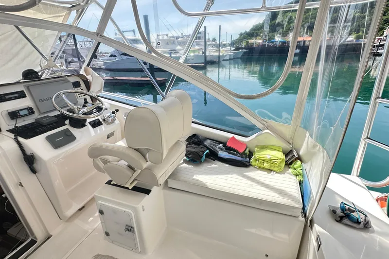  Yacht Photos Pics 2008 Luhrs 31 Hard Top IPS boat interior with helm, seating, and marina view.