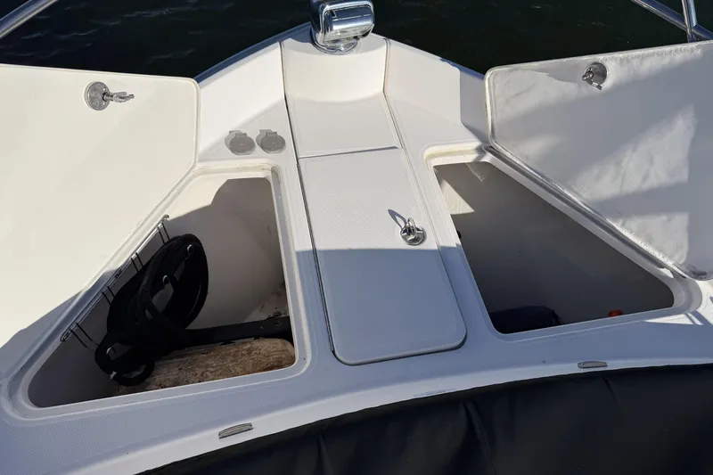 Dancing Queen Yacht Photos Pics 2019 Regal 42 Grande Coupe boat storage compartments with open hatches.