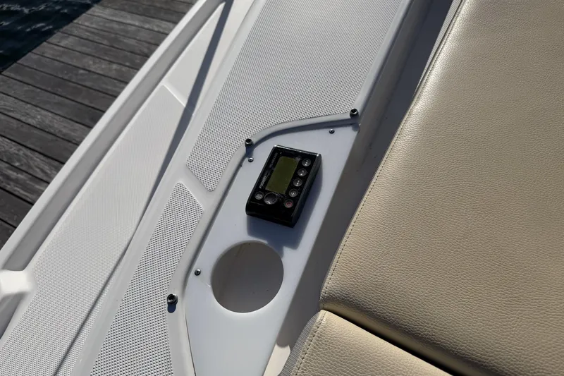 Dancing Queen Yacht Photos Pics Control panel on 2019 Regal 42 Grande Coupe boat deck, near beige seating.
