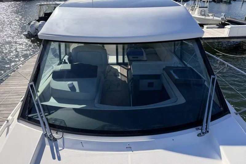 Dancing Queen Yacht Photos Pics 2019 Regal 42 Grande Coupe yacht docked, showcasing sleek design and spacious interior.