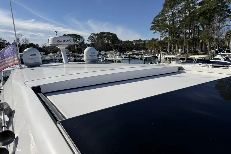 Dancing Queen Yacht Photos Pics 2019 Regal 42 Grande Coupe yacht with Garmin radar, docked in a marina.