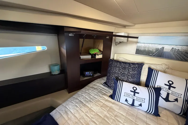 Dancing Queen Yacht Photos Pics Luxurious interior of 2019 Regal 42 Grande Coupe with nautical-themed decor.